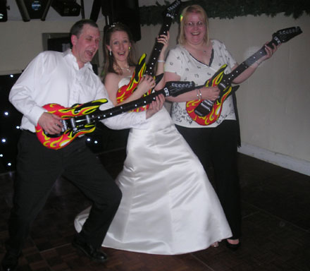 bride & guests play real air guitars!